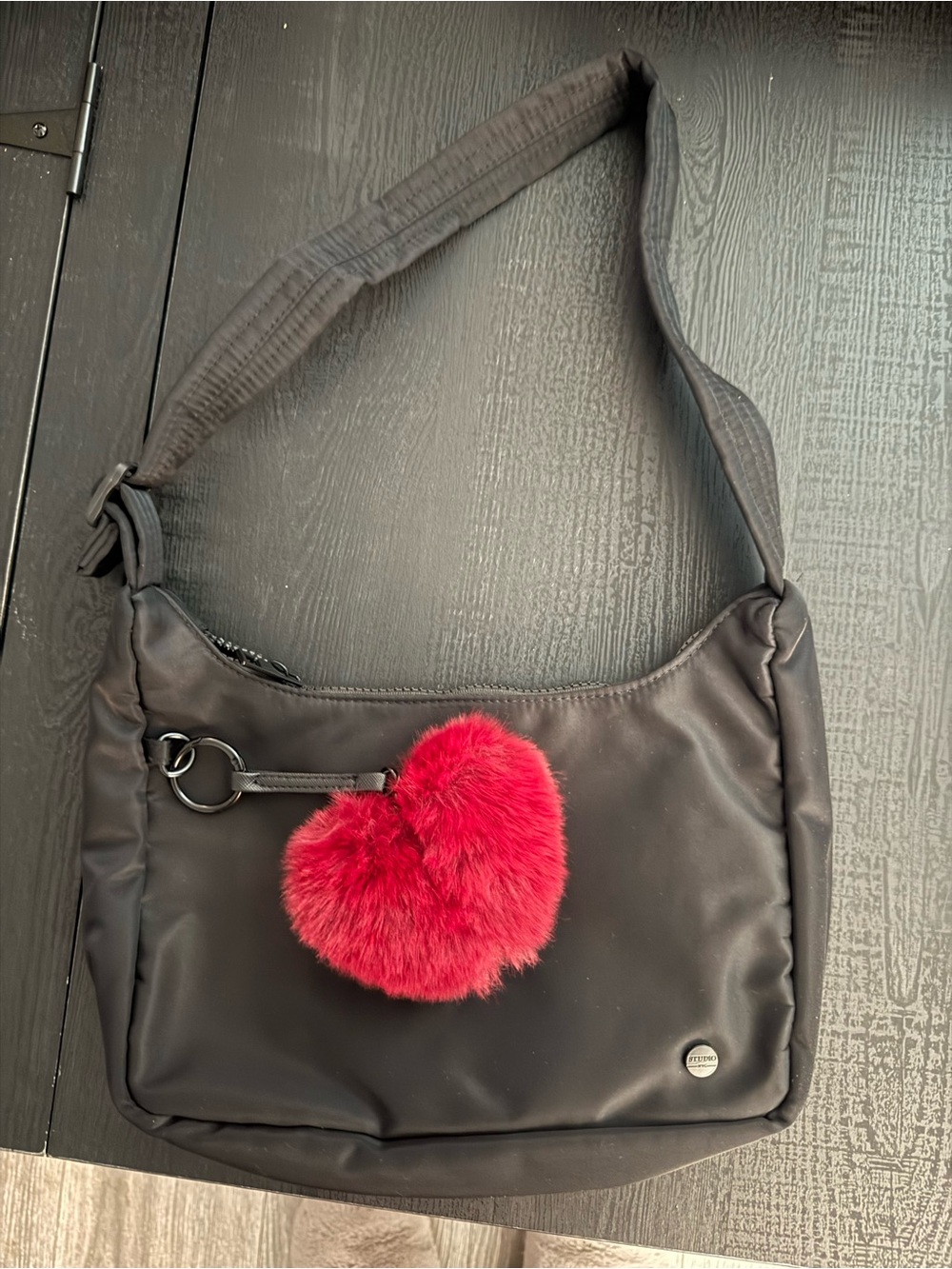 Black Shoulder Bag with Red Heart Pom Charm
